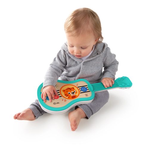 BABY EINSTEIN Zenélő fajáték ukulele Magic Touch HAPE - 6hó+