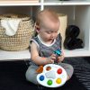 BABY EINSTEIN Zenélő érzékszervi játék Color Palette Popper - 6-36hó